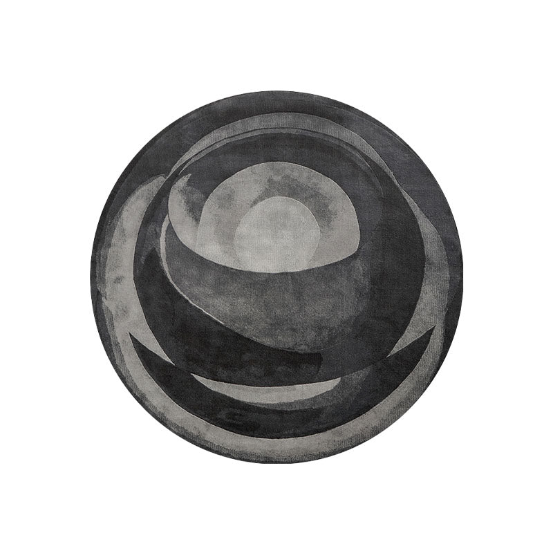 Etaoline round living room rug with circular concentric gray rings and textured surface in various styles available