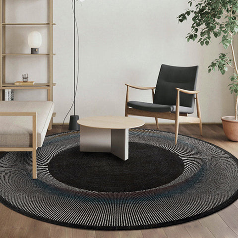Etaoline round living room rug with concentric black gray and blue textured woven rings in various styles available