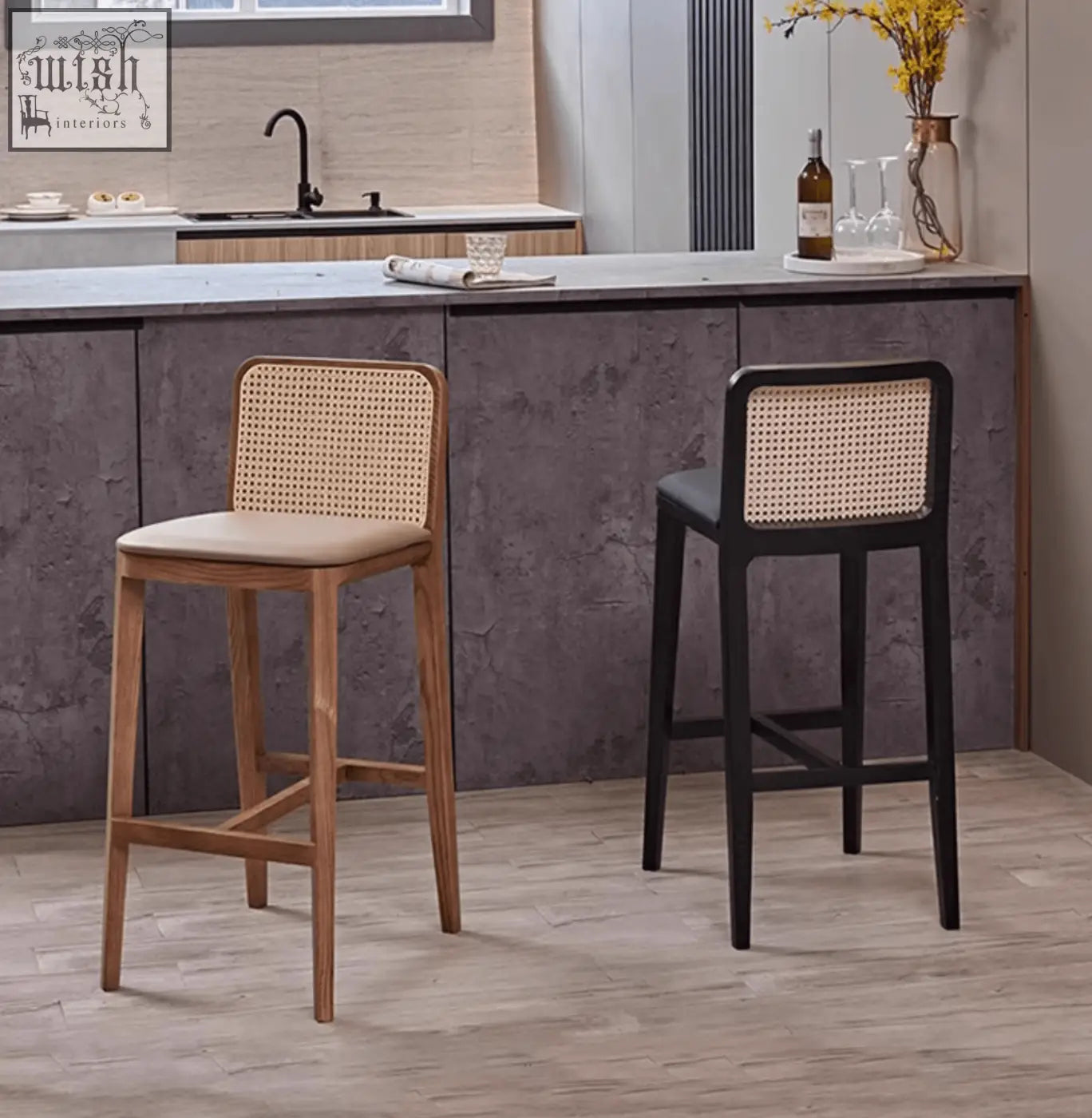 Two ethan rattan barstools with woven cane backs and wooden frames in natural and black perfect for coffee table set seating