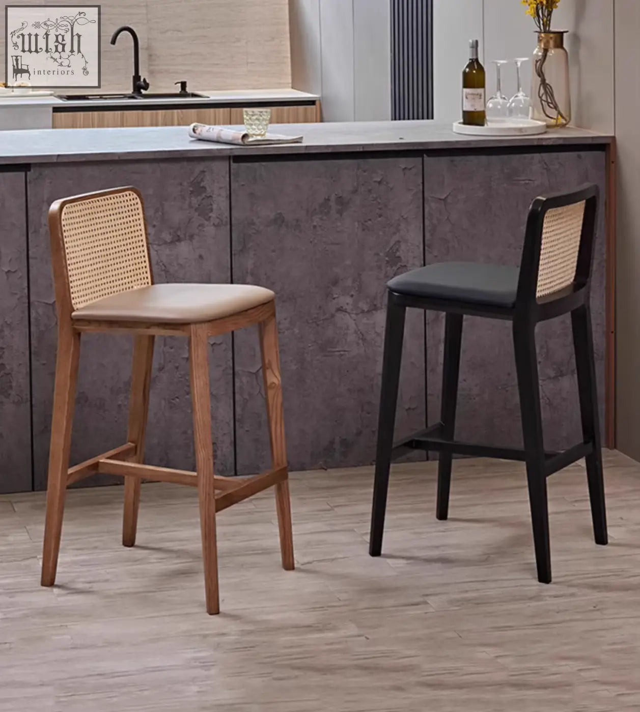 Two ethan rattan barstools with woven cane backs and natural wood and black frames perfect for coffee table set seating