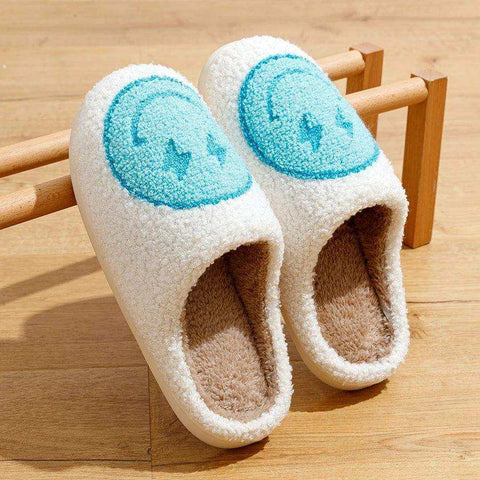 White fuzzy euphoria slippers with light blue smiley face embroidery perfect to stay warm and cozy