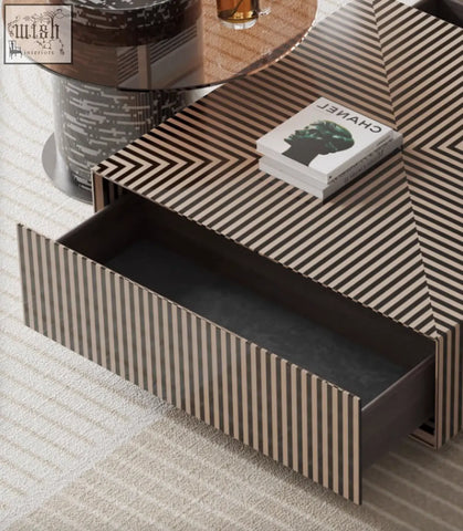 A modern evelyn coffee table set with black and beige geometric stripes and an open drawer showing dark interior perfect for living rooms