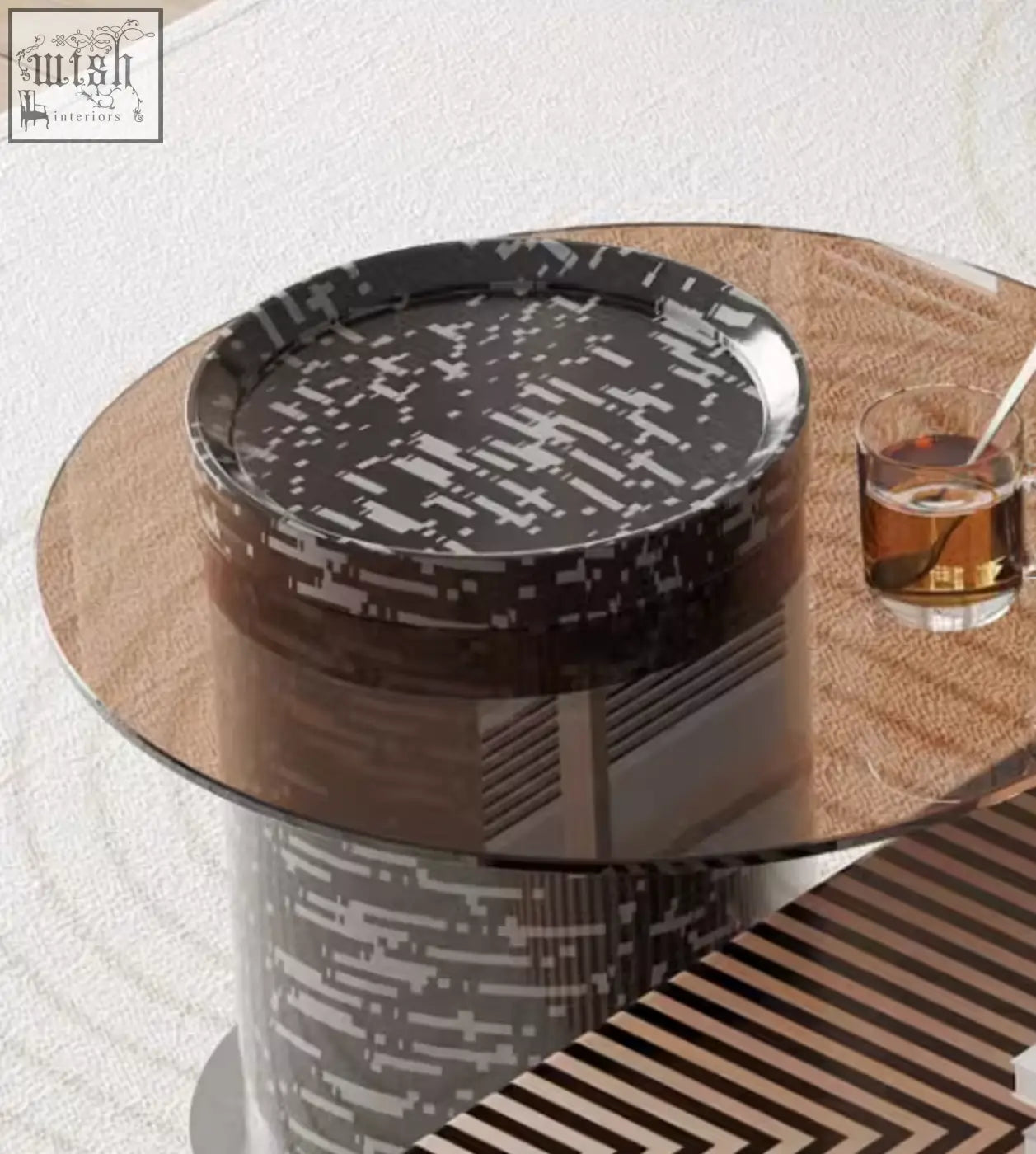 Modern round coffee table with glass top and bold black-and-white glitch pattern in the evelyn coffee table set