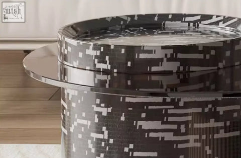 Evelyn coffee table set with a sleek cylindrical black and white pixelated design and a reflective silver rim perfect as a coffee table