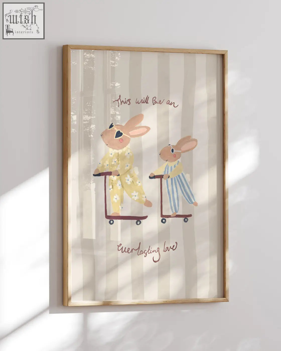 A framed big sister rabbit art print showing a rabbit pair in pajamas riding shopping carts with everlasting love text