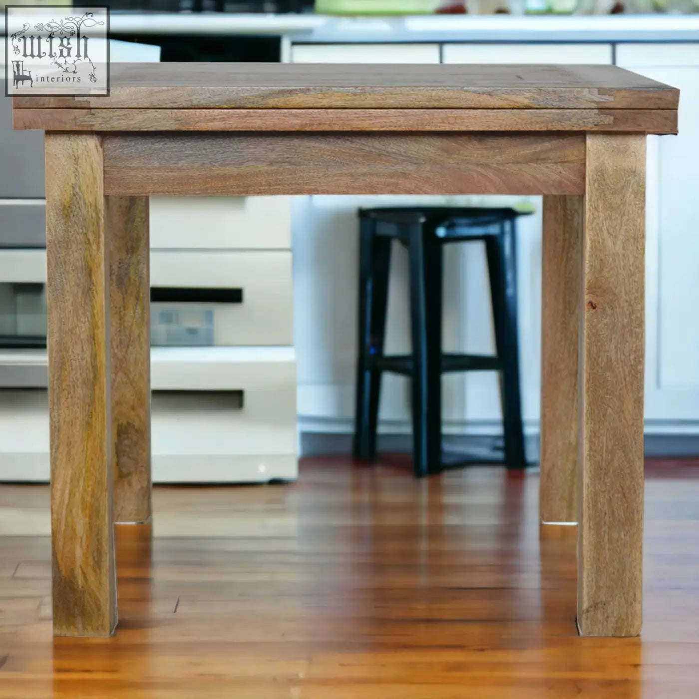 Rustic extendable butterfly dining table with oak finish and mango wood featuring warm natural finish and sturdy legs