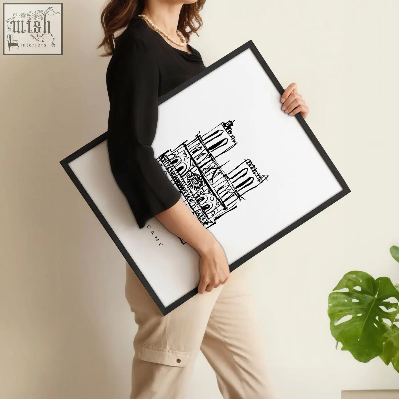 Black-framed extra large wall art with minimalist black ink illustration of notre dame cathedral on white background