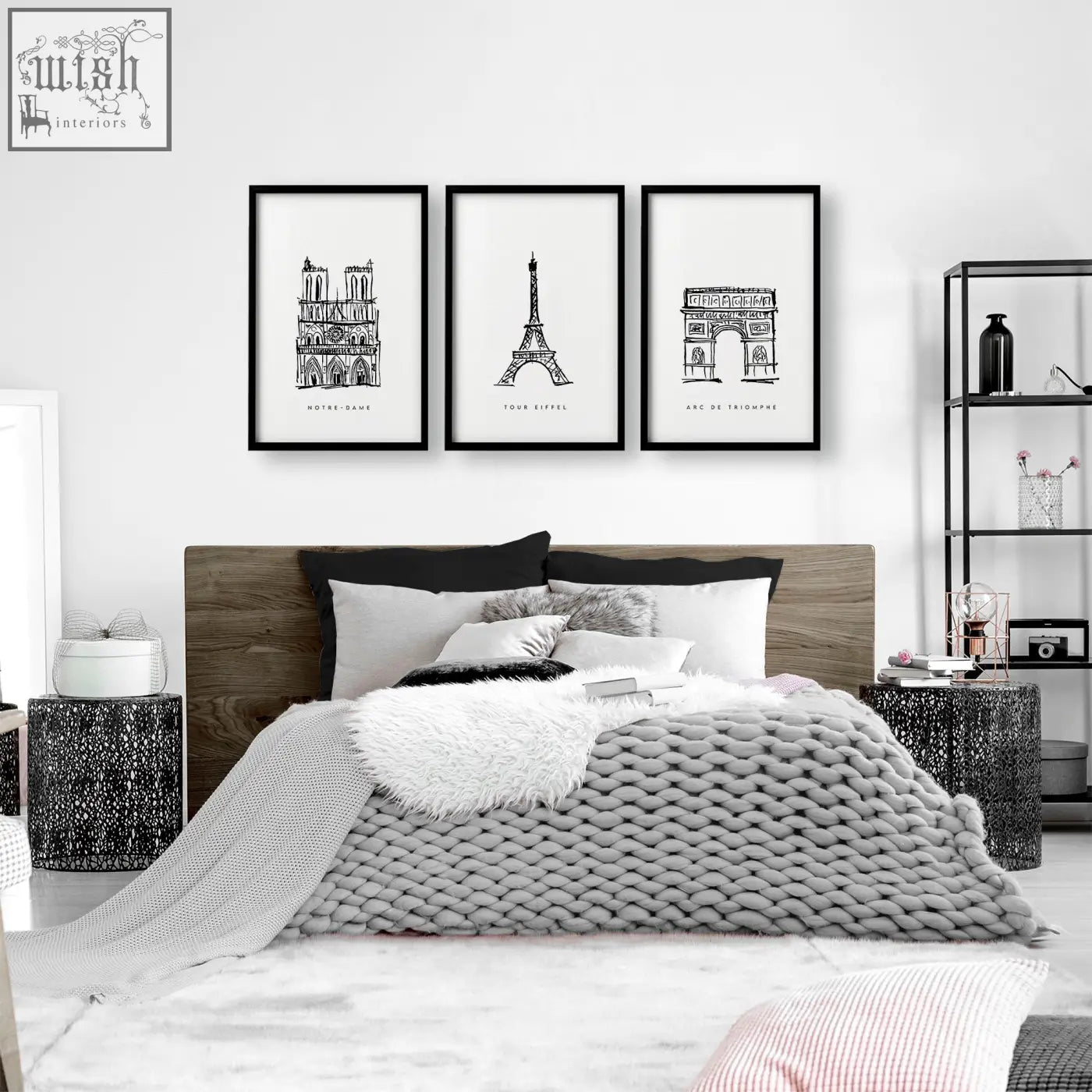 Three black-framed extra large wall art prints of parisian landmarks hang above the bed in a set of 3