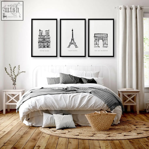 Set of three extra large black-framed wall art prints featuring paris landmarks notre dame eiffel tower and arc de triomphe in minimalist line art