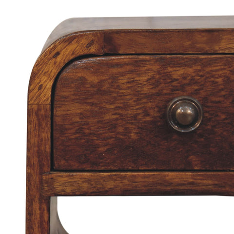Extra mini chestnut curve lower bedside table made of dark brown wood with a round brass knob on the drawer