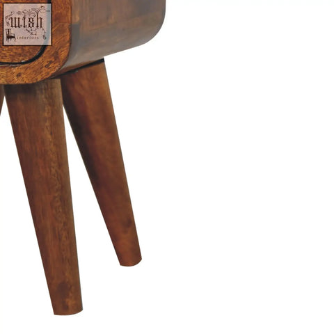 A sleek extra mini chestnut curve open slot wooden nightstand with tapered legs and warm brown finish
