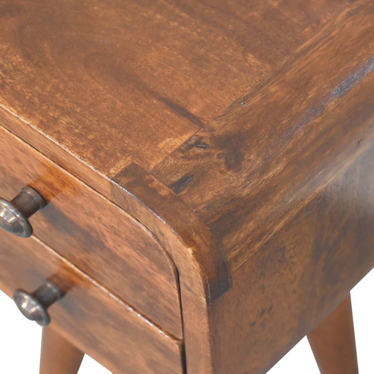 Extra mini curved chestnut bedside table with two drawers and dark metal knobs in rustic brown wood
