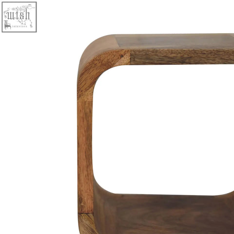 A modern extra mini minimalist open curved oak-ish bedside table with smooth rounded corners and natural wood grain open shelf