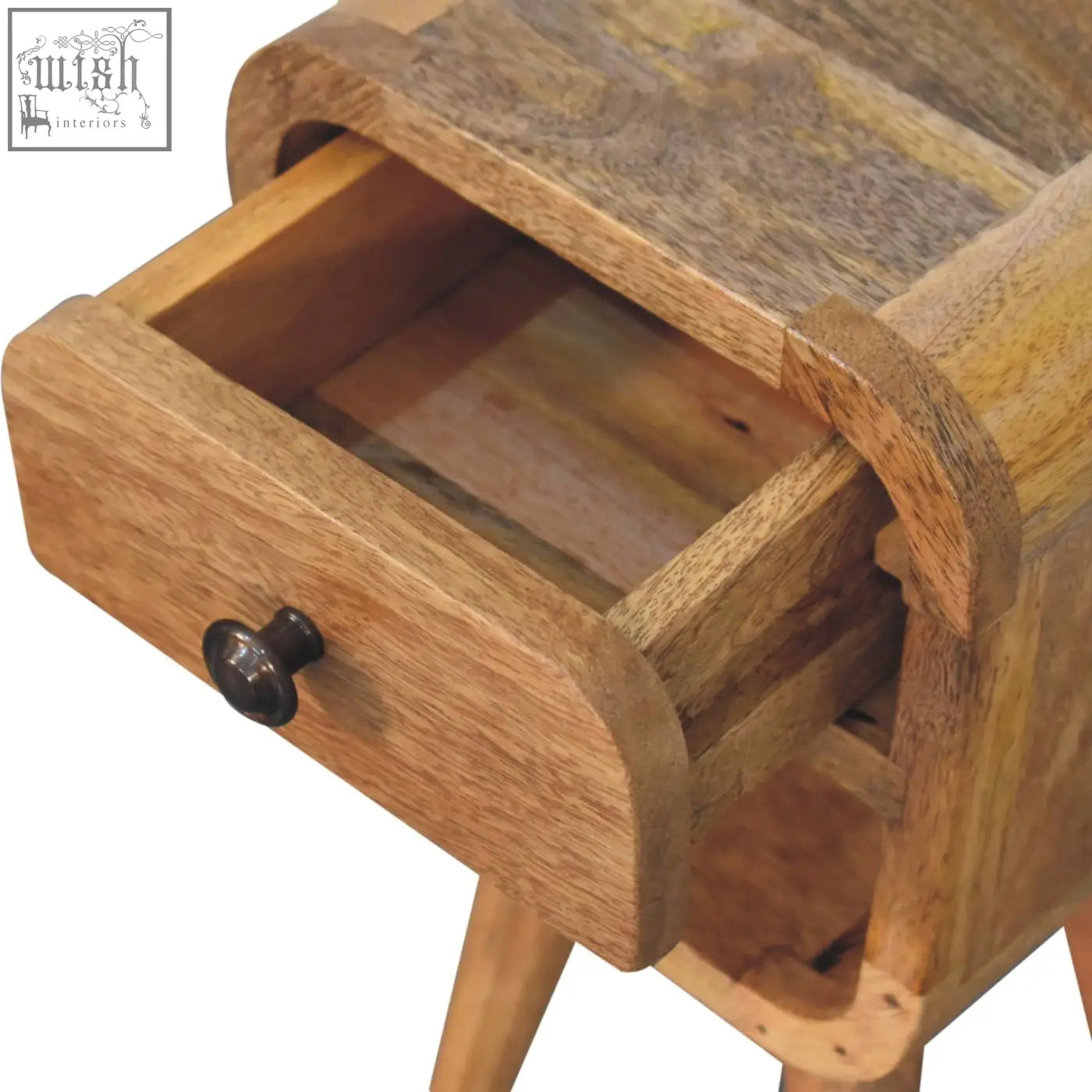 A rustic extra mini oak-ish curve lower bedside table with natural oak finish and dark metal knob on drawer front