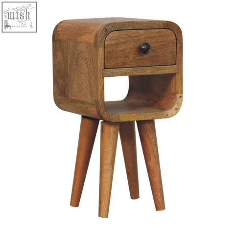A rustic extra mini oak-ish curve lower bedside table with a natural oak finish, single drawer, and dark metal knob