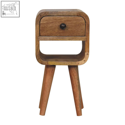 A rustic extra mini oak-ish curve lower bedside table with natural oak finish, single drawer, and black round knob