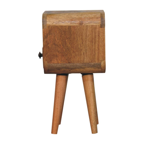 A rustic wooden extra mini oakish curve bedside table with a warm finish and an open slot design