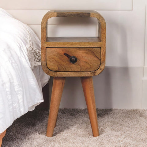A rustic extra mini oakish curve wooden nightstand with a single drawer and open slot for bedside use