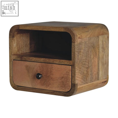 A rustic light brown extra mini wall mounted bedside with rounded edges made of mango wood and an open slot design