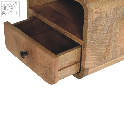 Extra mini wall mounted bedside with open slot made of mango wood featuring rustic natural grain and dark metal knob