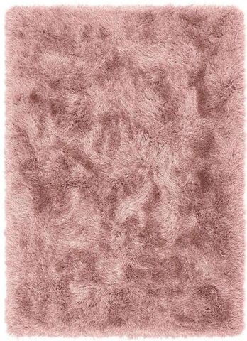 A plush extravagance rose shaggy rug with soft fluffy texture and subtle pink shade variations