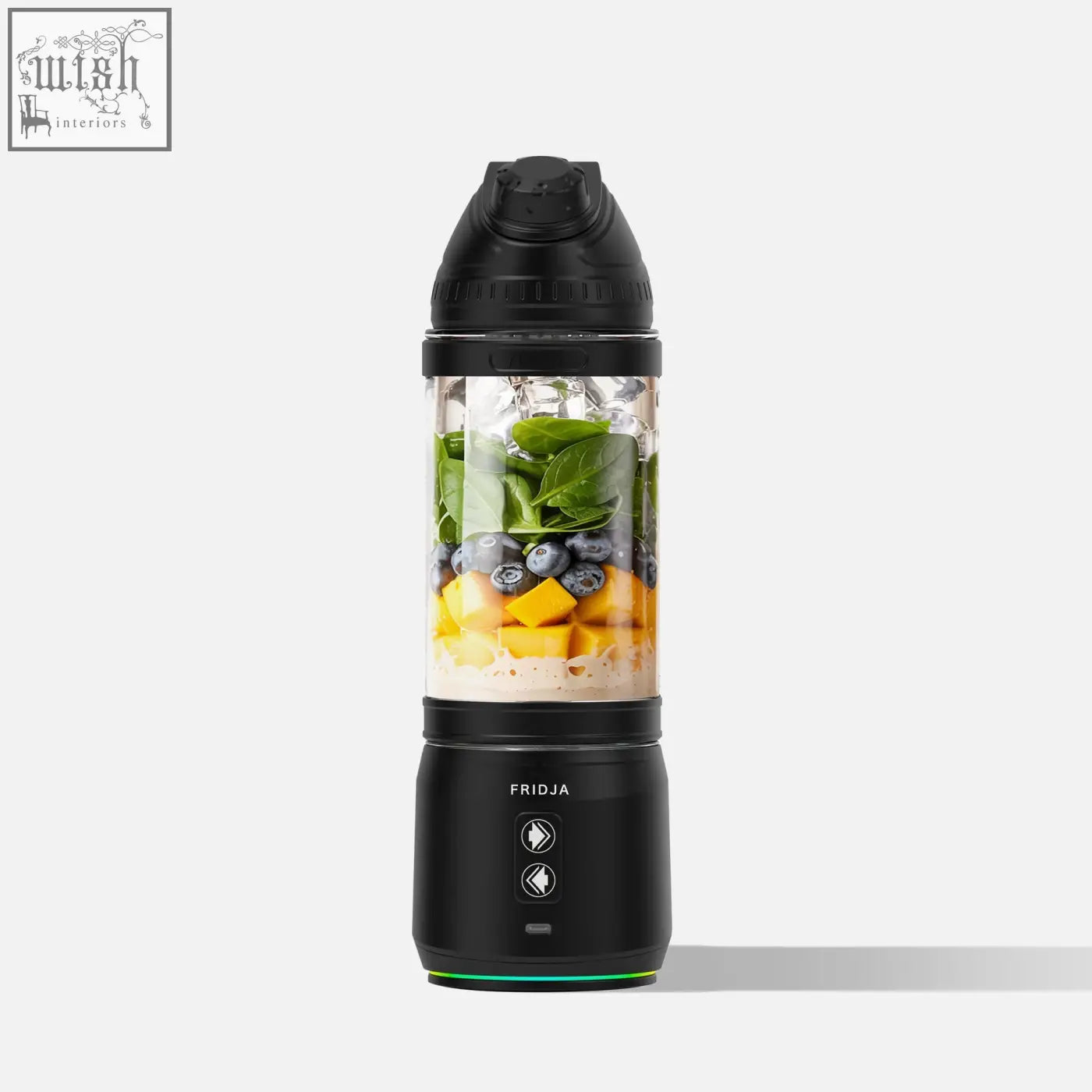 Black fridja f500 portable blender filled with fresh greens blueberries and mango chunks for on the go use