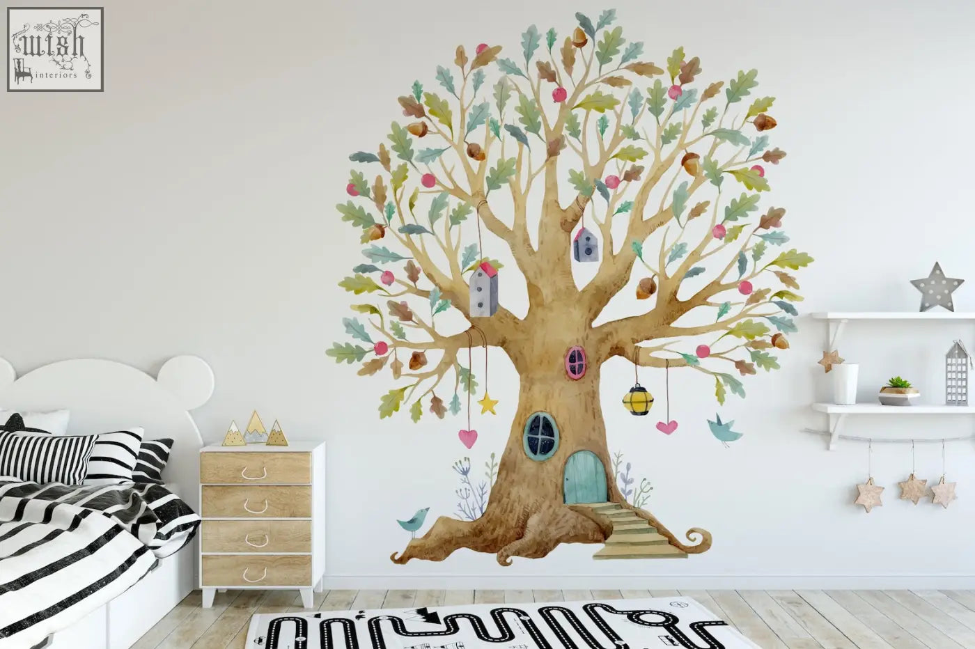 Whimsical fairy tree house wall decal with brown trunk green leaves pink apples and blue door in watercolor style
