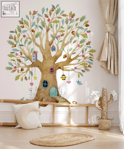 Whimsical fairy tree house wall decal with golden trunk green leaves and pink apples in magical wildflower garden style