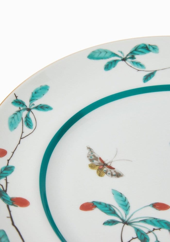 A delicate famille verte dinner plate set of 4 with turquoise leaves red berries and a small yellow butterfly design
