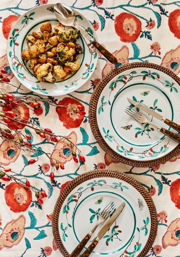 White ceramic famille verte dinner plate with green and red floral border and small butterfly design set of 4