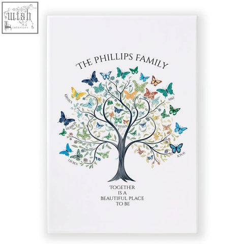 White canvas family tree art with black trunk, colorful butterflies, names, and phillips family text above and below