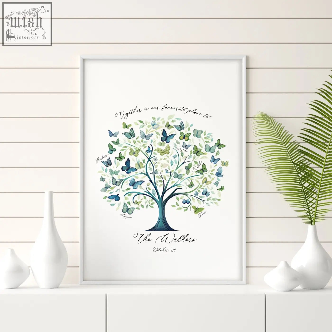 A framed family tree print with a dark teal trunk, green leaves, blue green butterflies, personalized with the walkers and date