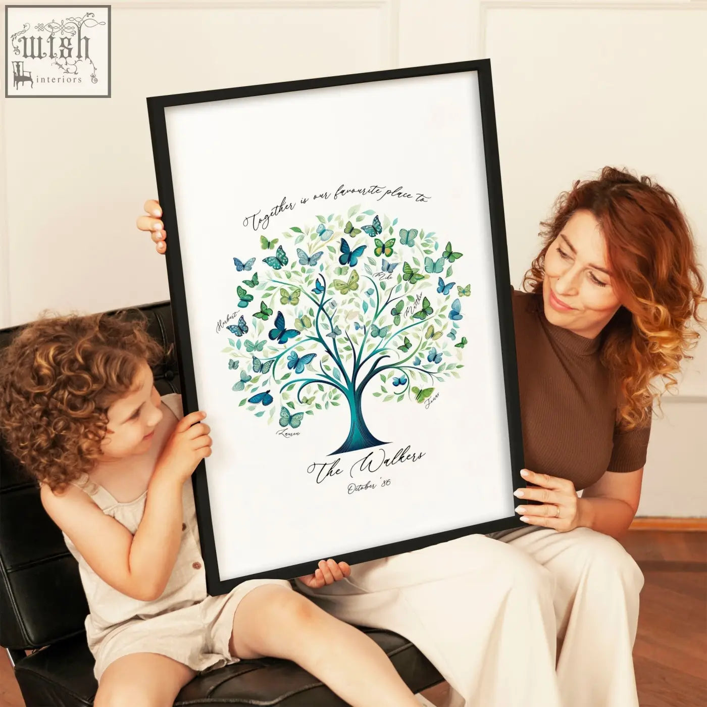 A family tree print featuring blue and green butterfly design personalized with names in a black frame