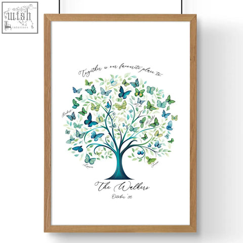 Family tree print featuring a teal and green watercolor tree with butterflies personalized october 86 in a light wood frame