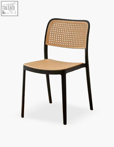 Black-framed fanny dining chair with woven cane seat and backrest perfect for stylish dining spaces