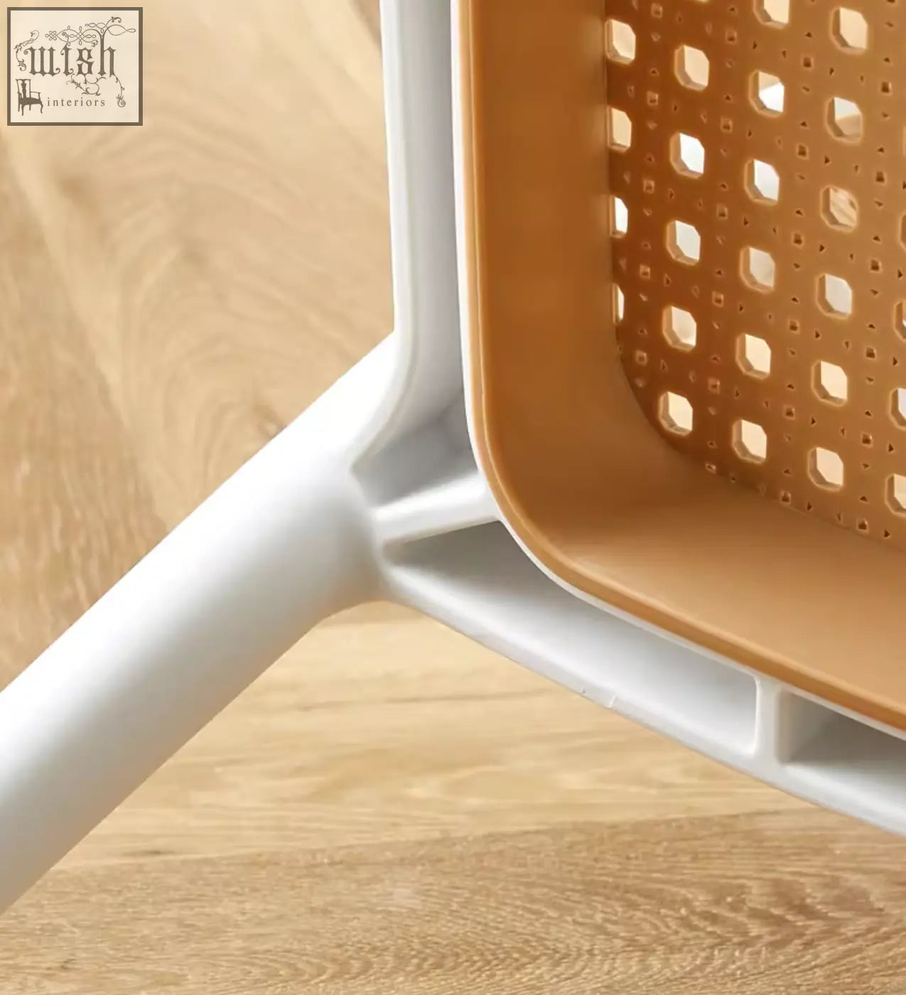 Fanny dining chair featuring a modern two-tone plastic basket with a white frame and tan perforated sides