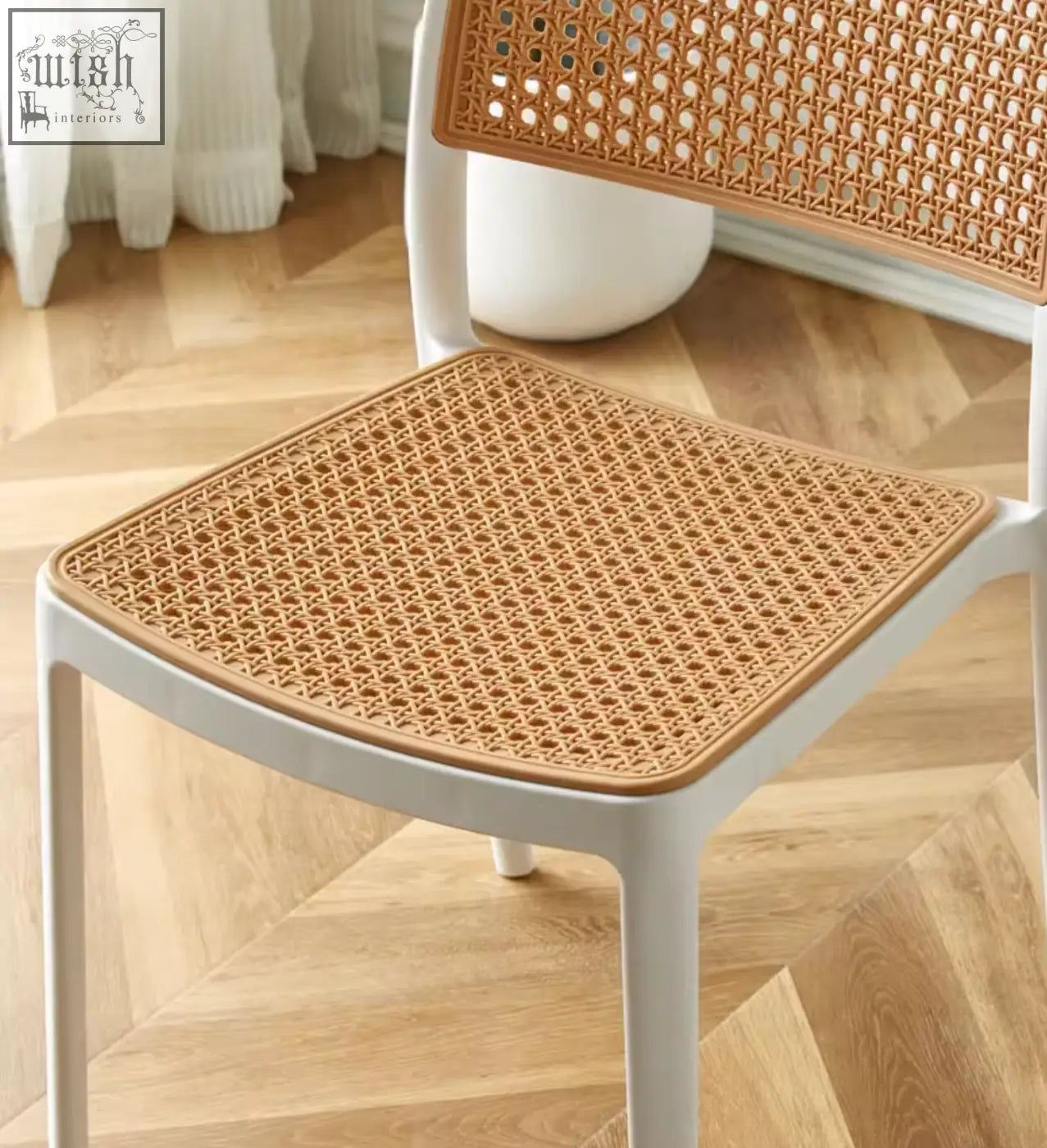 Tan woven rattan chair pad with smooth raised border for fanny dining chair adds comfort and style to dining chair