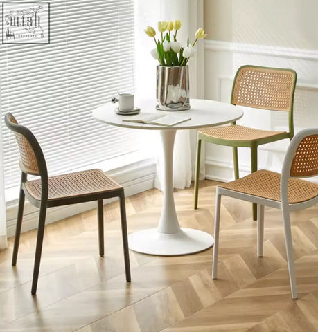 White round fanny dining chair table with sleek pedestal base and minimalist design for modern dining spaces