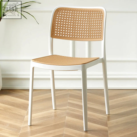 White fanny dining chair with woven cane back and seat perfect for stylish dining spaces