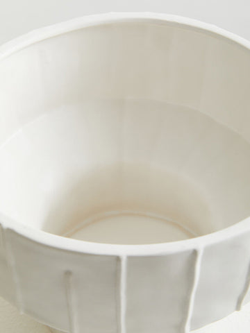 A fara white vase ceramic bowl with fluted ribbed exterior and smooth interior in white color