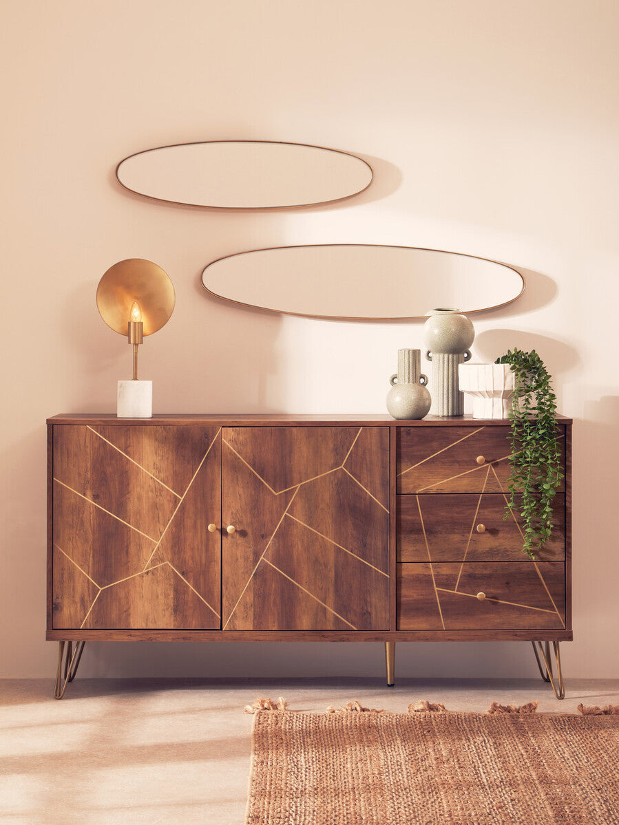 A modern wooden sideboard with geometric gold inlay and metal legs displayed next to the fara white vase