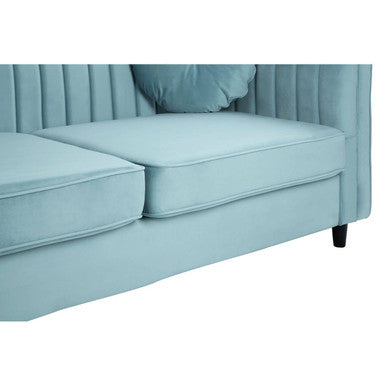 Pastel green velvet three seater sofa with tufted back and cushioned seat for cozy living room seating