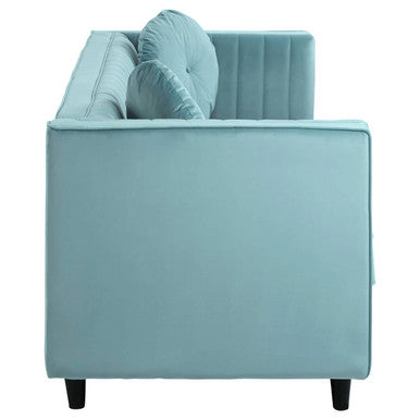 Light blue velvet tufted three seater sofa with matching throw pillows similar to pastel green velvet sofa style
