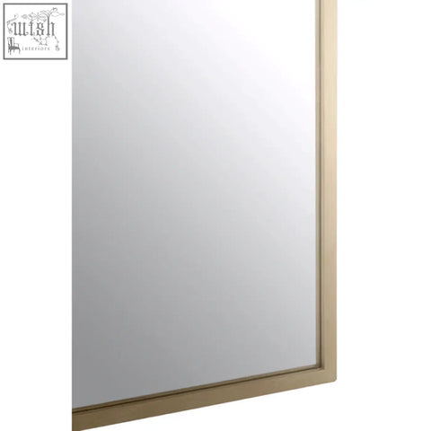 A sleek rectangular farran bird wall mirror with a thin gold-toned metal frame showcasing modern wall mirror features