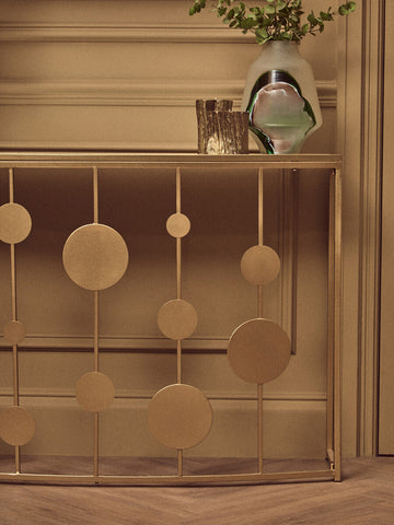 Farran champagne gold finish console table with gold-toned metal and circular disc accents with mirror top