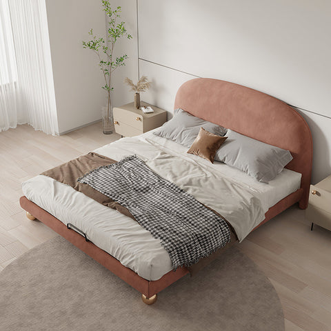 Fatima bed king size size bed with soft pink upholstered headboard and light gray bedding with houndstooth throw