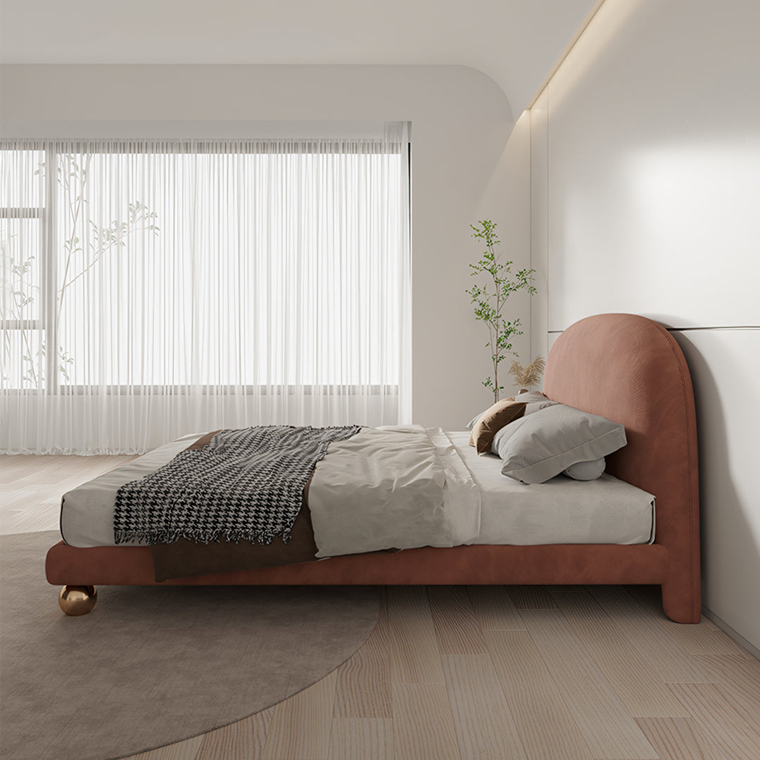 Fatima bed king size bed in rose velvet with curved headboard and gold spherical feet perfect for a girl’s room