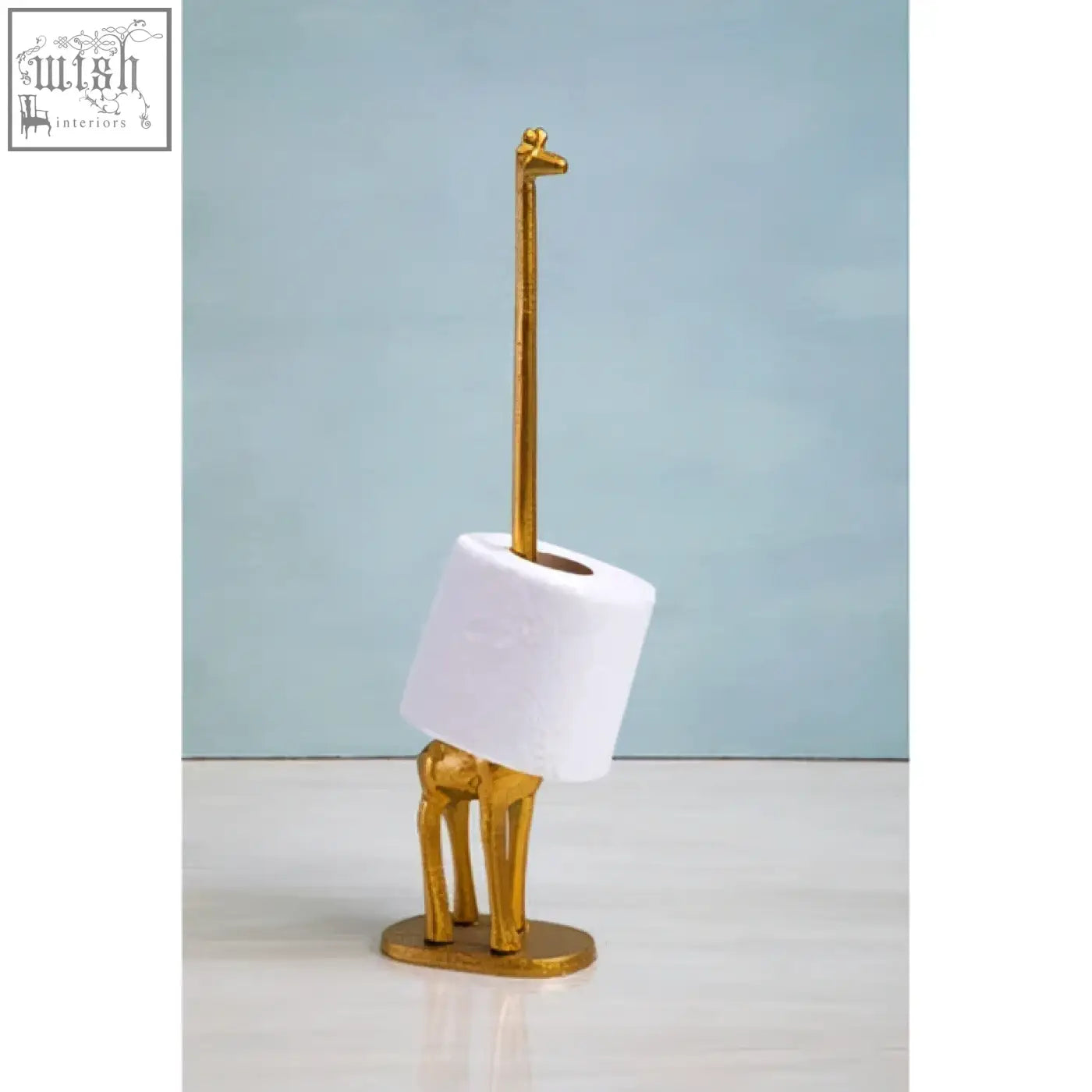 Fauna gold finish giraffe toilet roll holder with a white toilet roll for a stylish bathroom roll holder