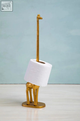 Fauna gold finish giraffe toilet roll holder with a gold-colored giraffe shape and white toilet roll on its neck