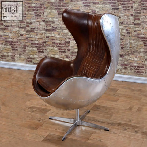 Brown leather and silver metal fawkes aviator office egg chair with riveted seams and aluminum shell